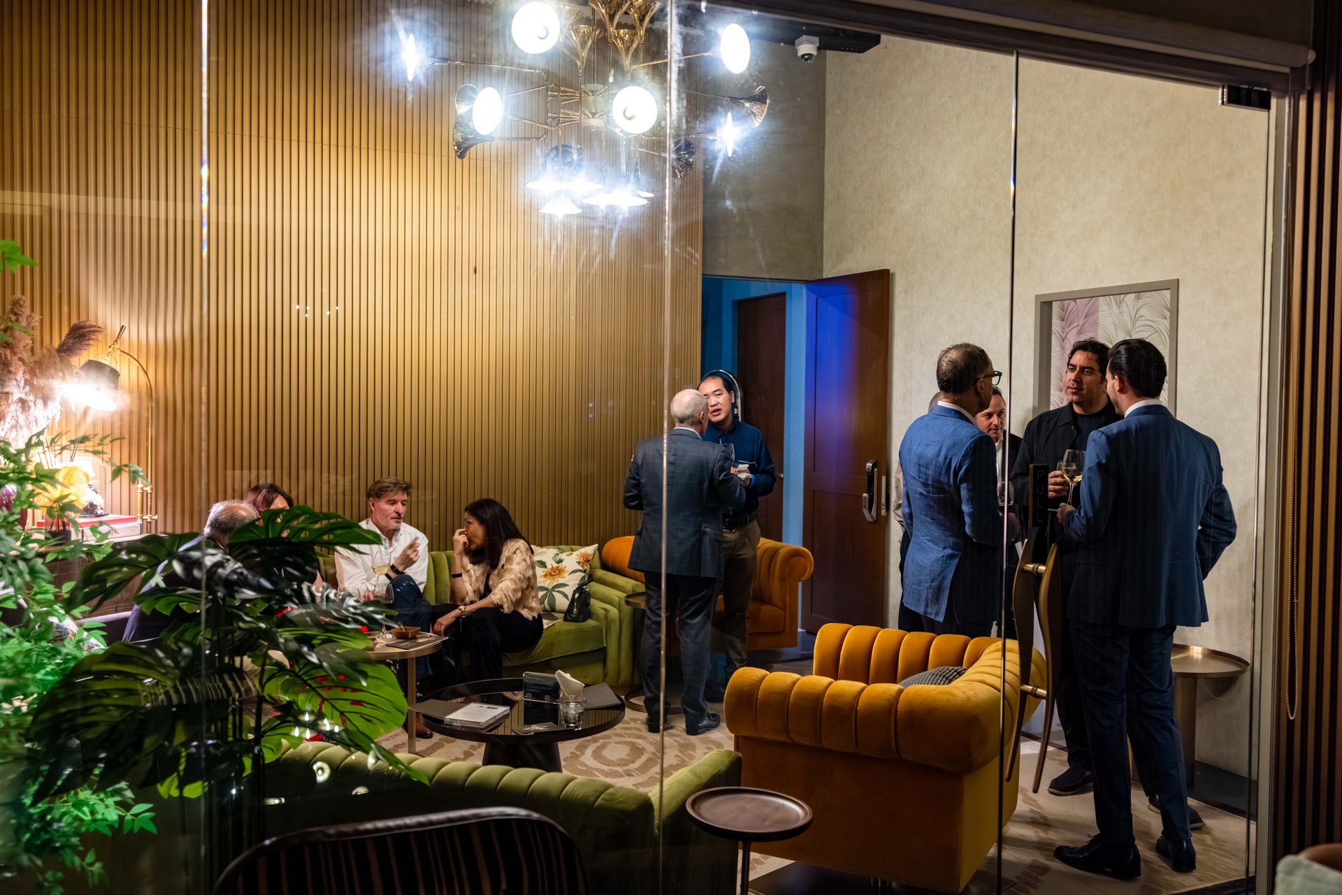 Guests connecting in Pacific Club’s lounge seating area