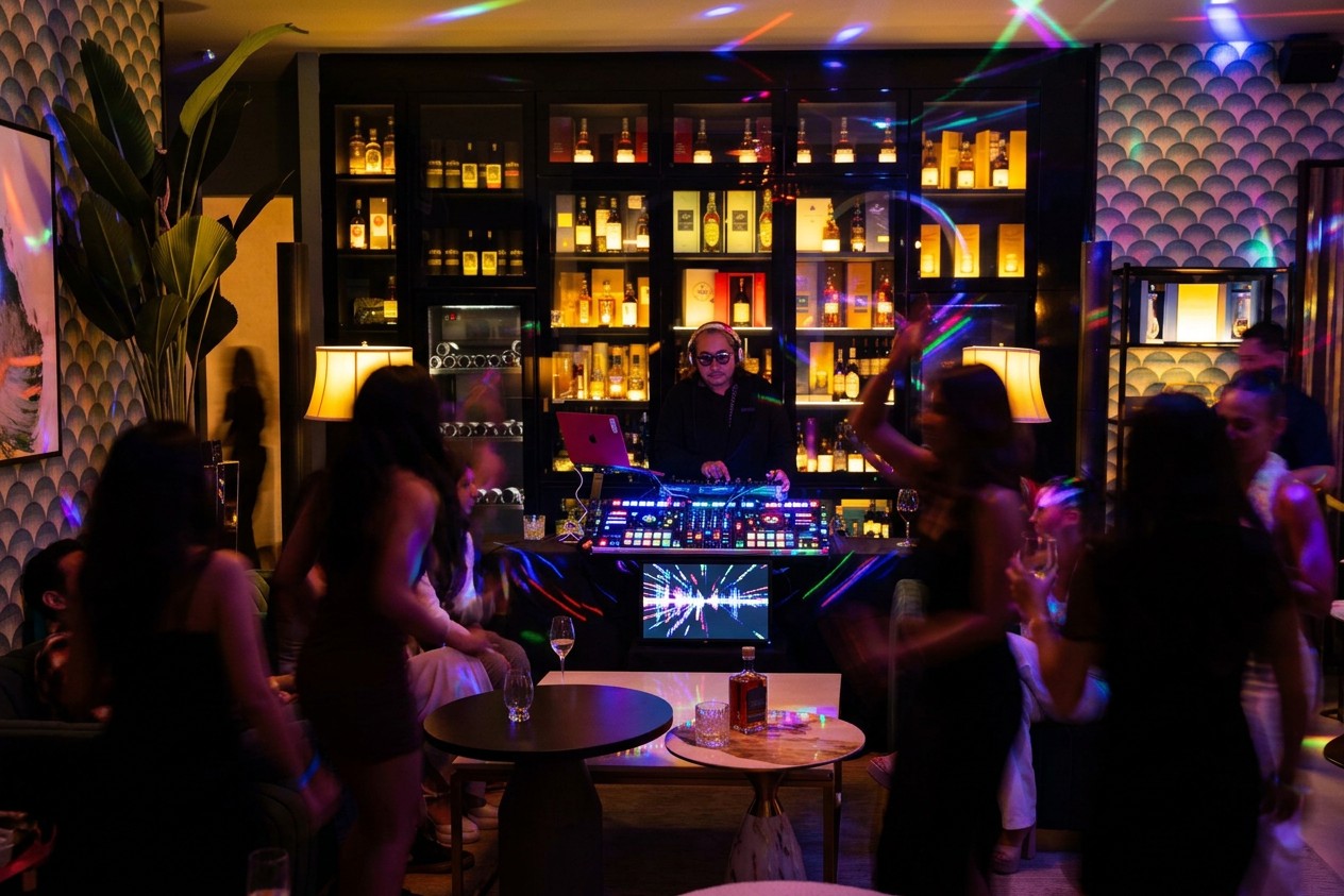 Guests sharing an evening beside the Main Room tasting bar